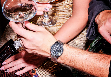 wristwatch adorned with kite flatback crystal on a hand 