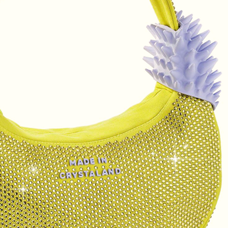 handbag covered in acid yellow flatback crystals