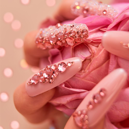 deatil of nails with rose peach crystals