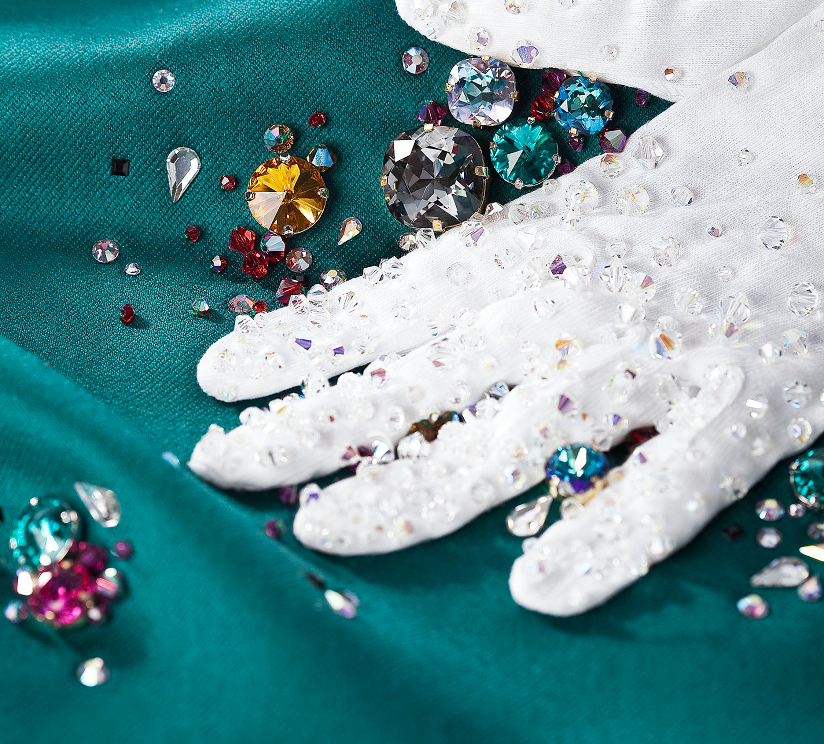 Various colors of fancy and sew on crystals, rhinestones and beads on a fabric